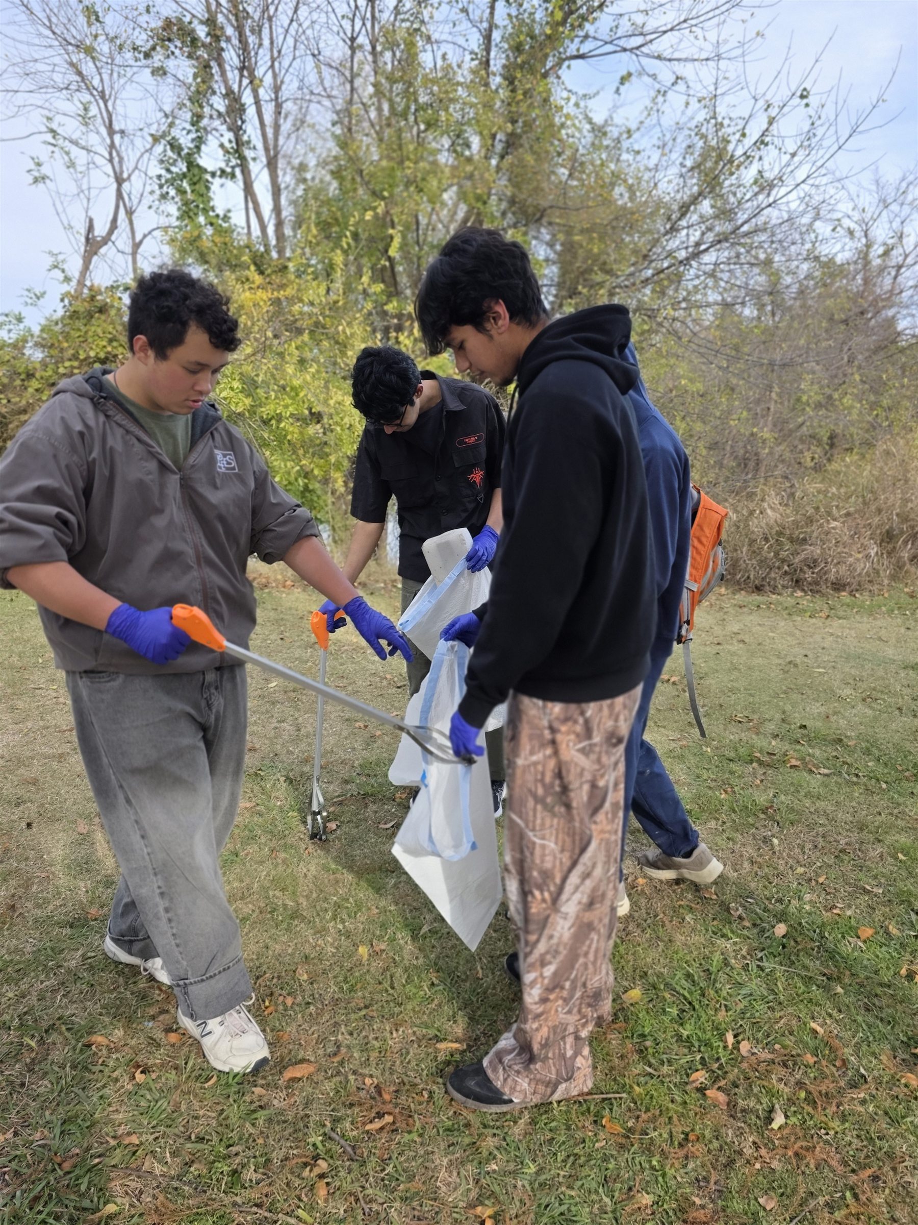 Students collecting litter together at Archgate Park